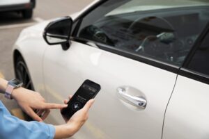 Hand Using Phone Unlock Car