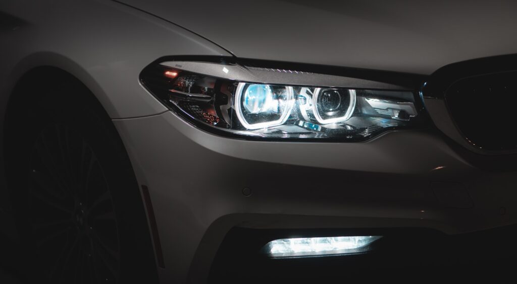 Gray Car With White and Blue Lights