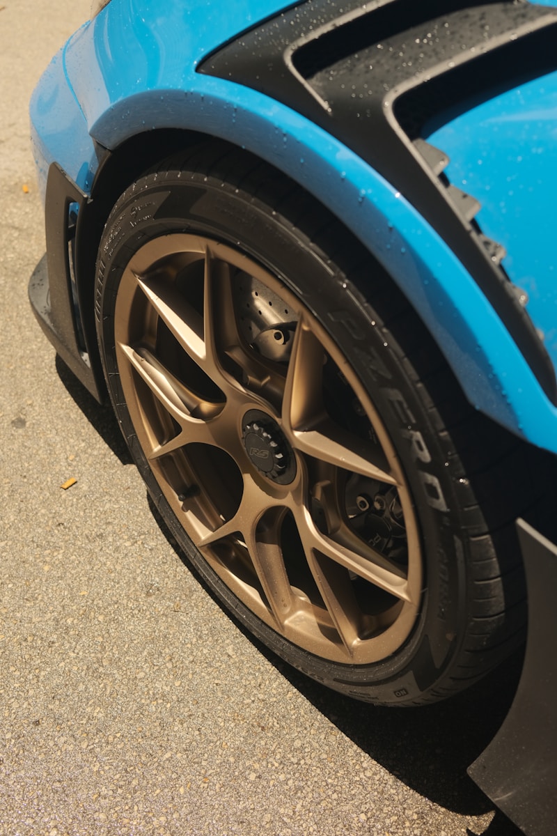 A Blue Sports Car Parked on the Side of the Road